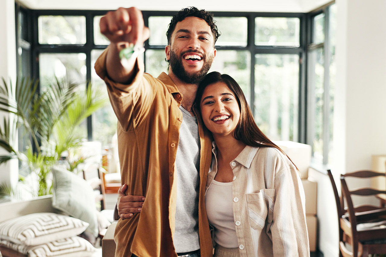 happy home buyers in new home stock photo